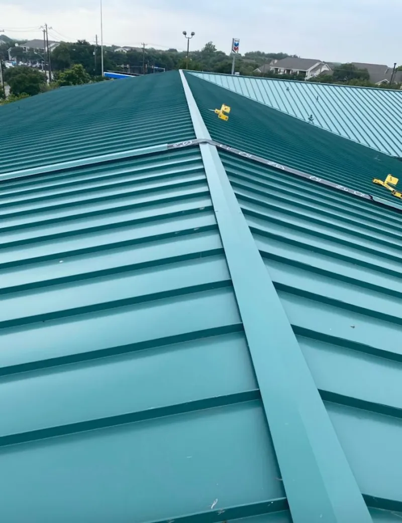 Green commercial metal roof ridge and valley for Metal Roof Repair in Manvel